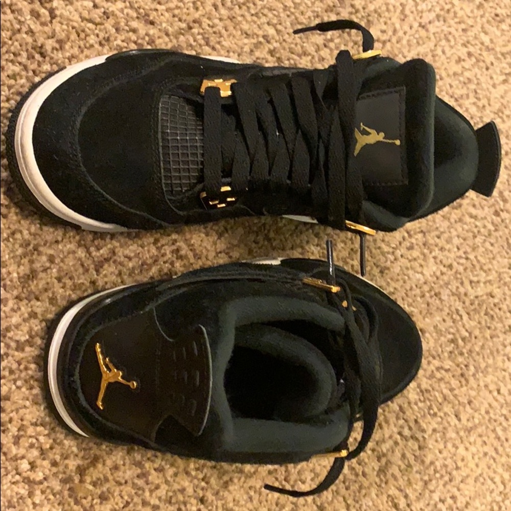 Air Jordan 4 retro “Royalty” black and gold.